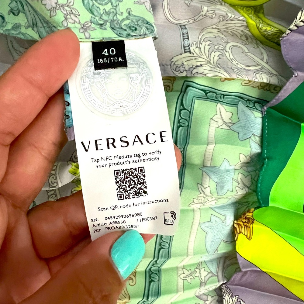 Versace  fits like a small , worn once!!